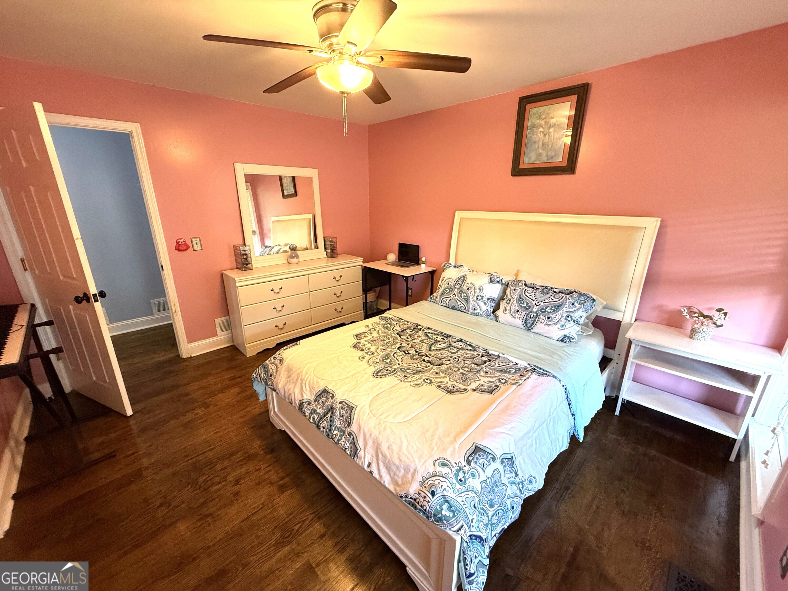 725 Musgrove Road Griffin, GA 30223 - Photo 33 of 52 a bedroom with a bed and a flat screen tv