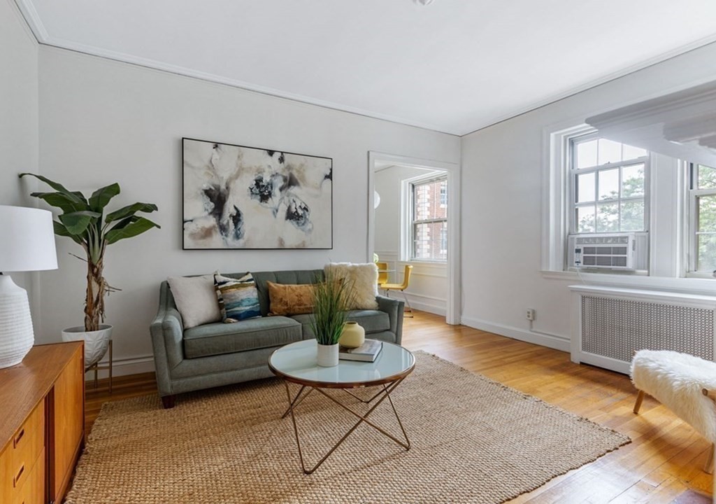 5 Arlington Street, Unit 34 Cambridge, MA 02140 - Photo 1 of 12 a living room with furniture potted plant and window