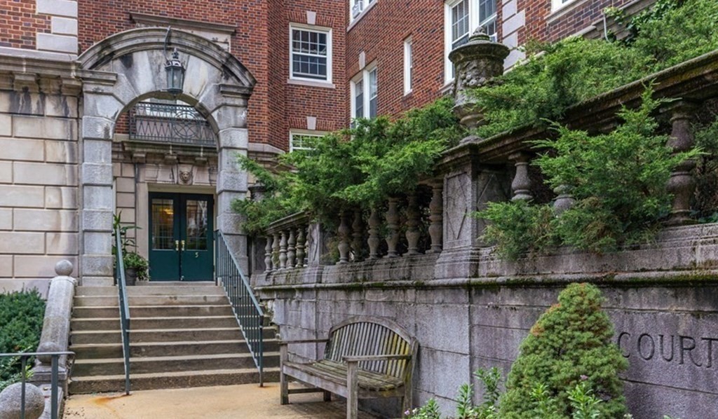 5 Arlington Street, Unit 34 Cambridge, MA 02140 - Photo 12 of 12 a view of a building with a porch