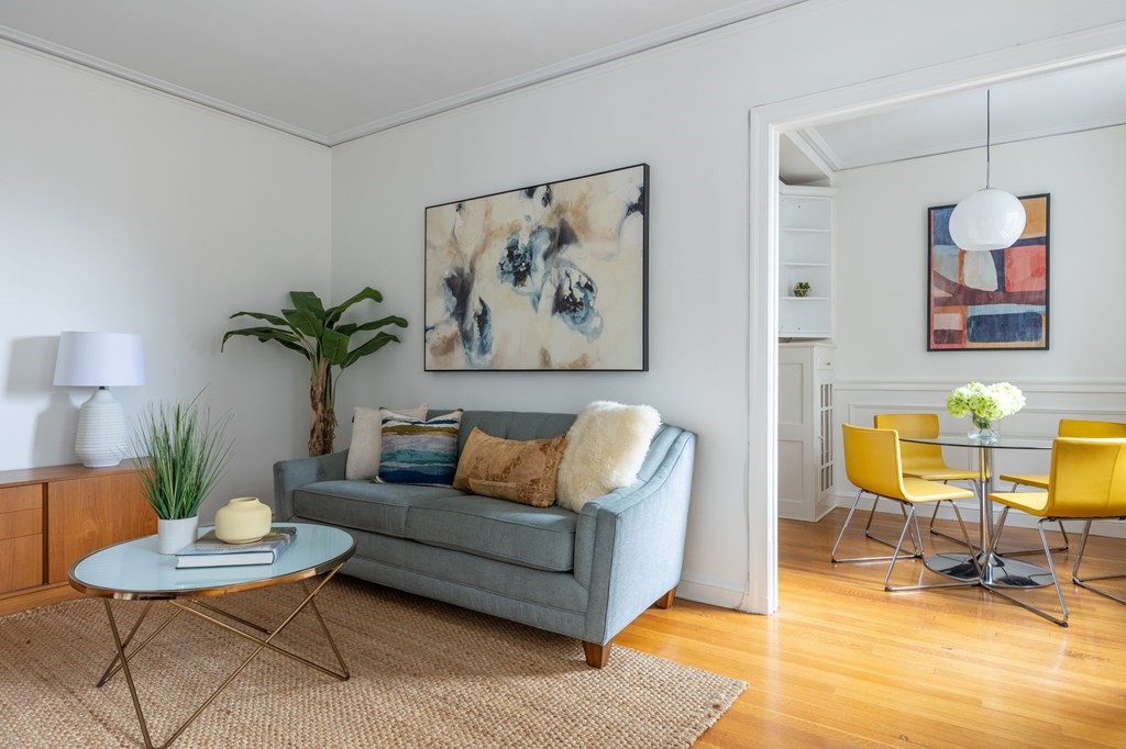 5 Arlington Street, Unit 34 Cambridge, MA 02140 - Photo 3 of 12 a living room with furniture and a potted plant