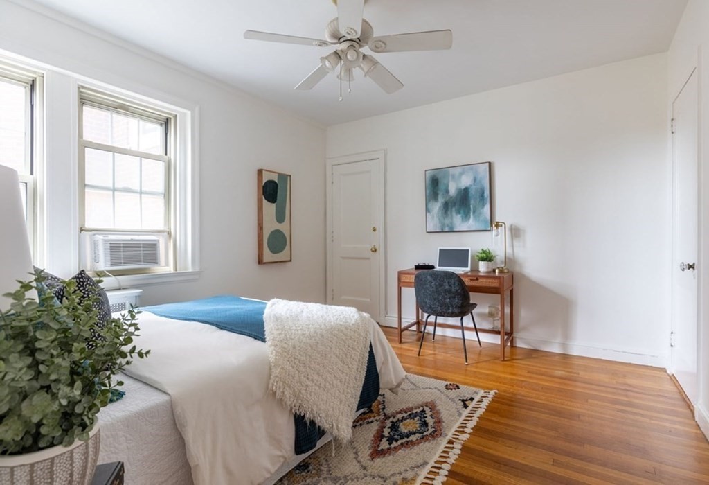 5 Arlington Street, Unit 34 Cambridge, MA 02140 - Photo 8 of 12 a living room with furniture and a window