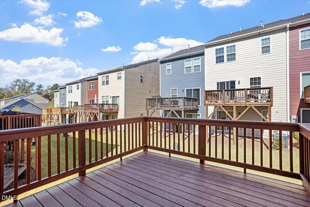 a view of a balcony with wooden floor