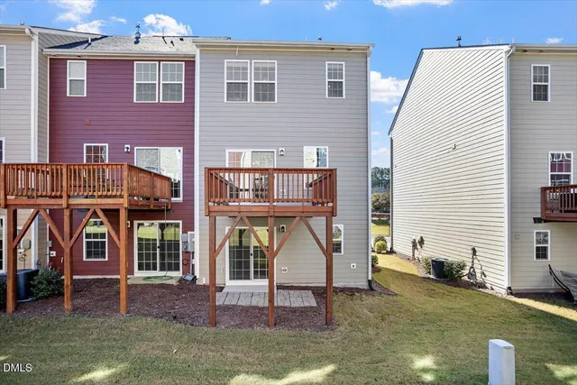 a view of a house with wooden fence
