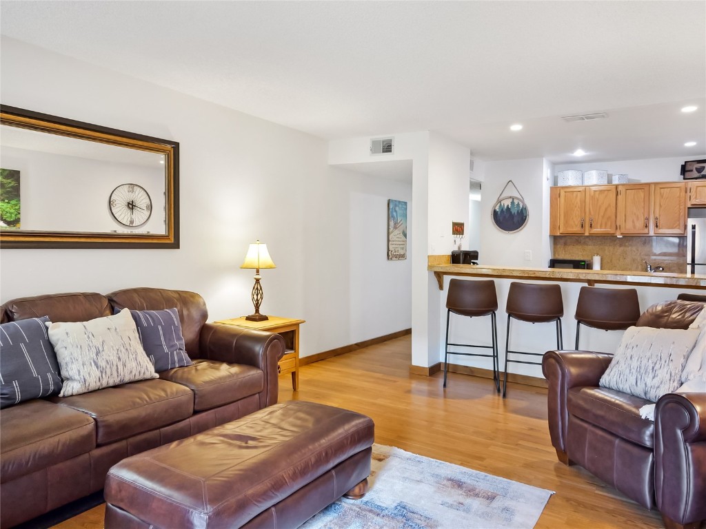 500 Bills Ranch Road, Unit 211 Frisco, CO 80443 - Photo 5 of 40 a living room with furniture and wooden floor