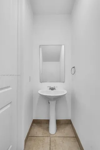 a bathroom with a sink and vanity