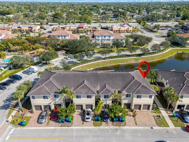 an aerial view of a house with a swimming pool yard and outdoor seating
