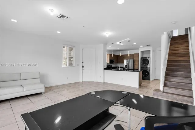 a view of kitchen with furniture and window