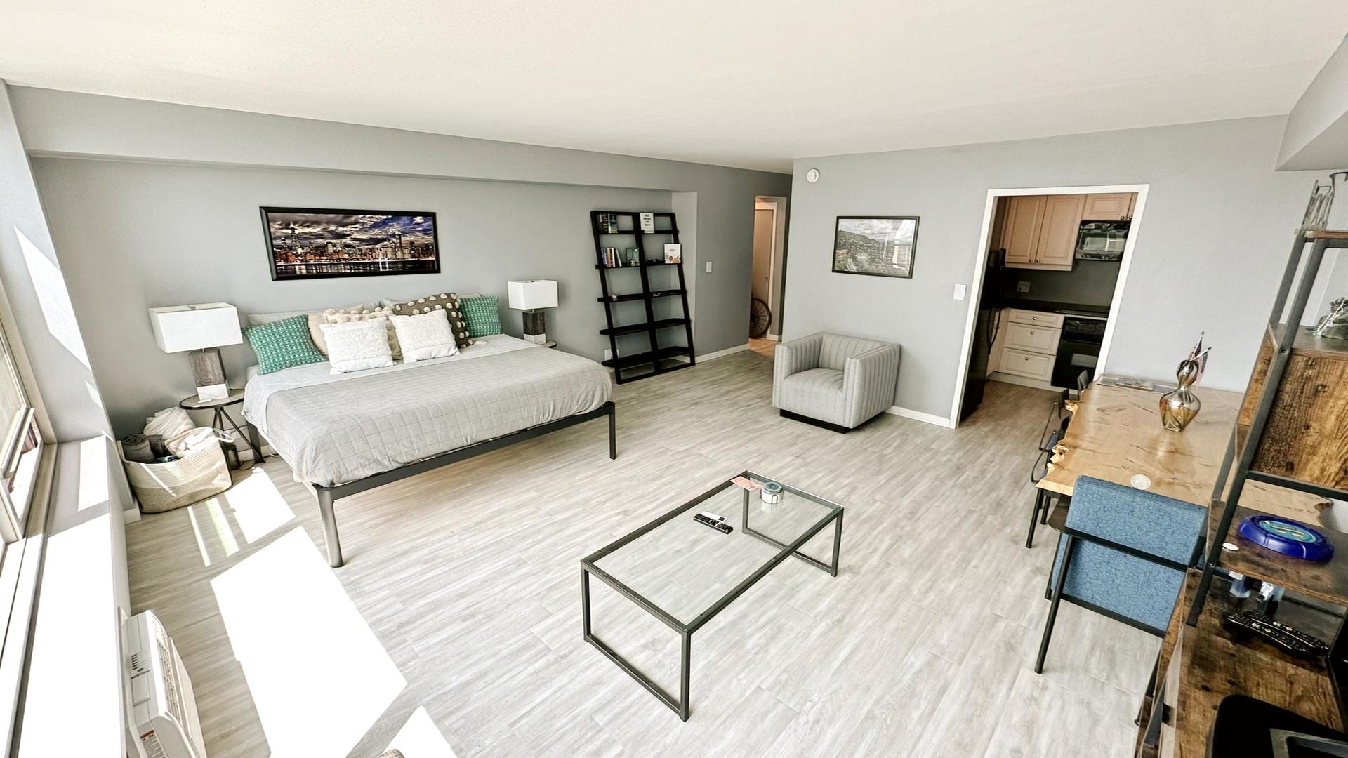 3600 North Lake Shore Drive, Unit 2223 Chicago, IL 60613 - Photo 5 of 9 a living room with furniture and wooden floor