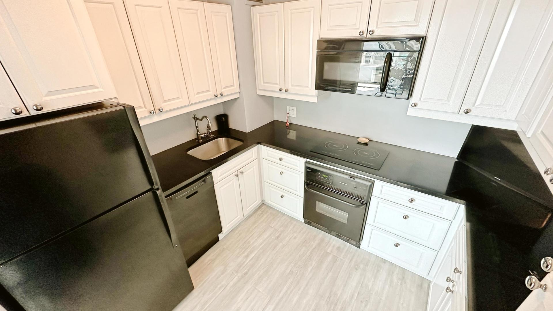 3600 North Lake Shore Drive, Unit 2223 Chicago, IL 60613 - Photo 6 of 9 a kitchen with a sink and a refrigerator