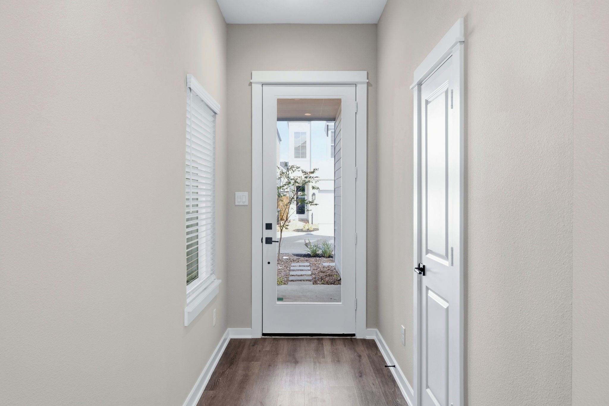 412 Stonework Landing Lane Houston, TX 77076 - Photo 24 of 30 a view of a room with wooden floor and a window