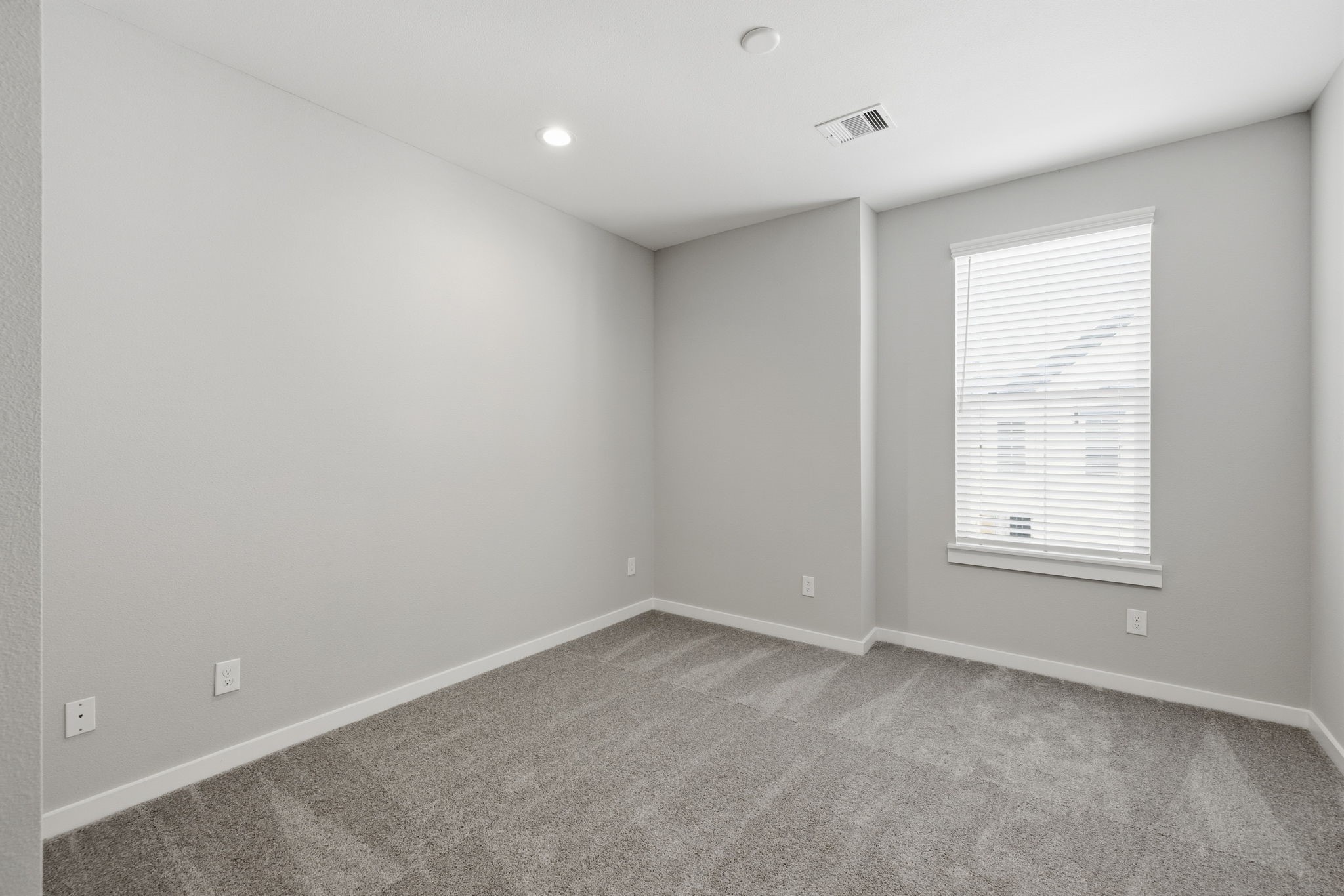 412 Stonework Landing Lane Houston, TX 77076 - Photo 27 of 30 an empty room with a window