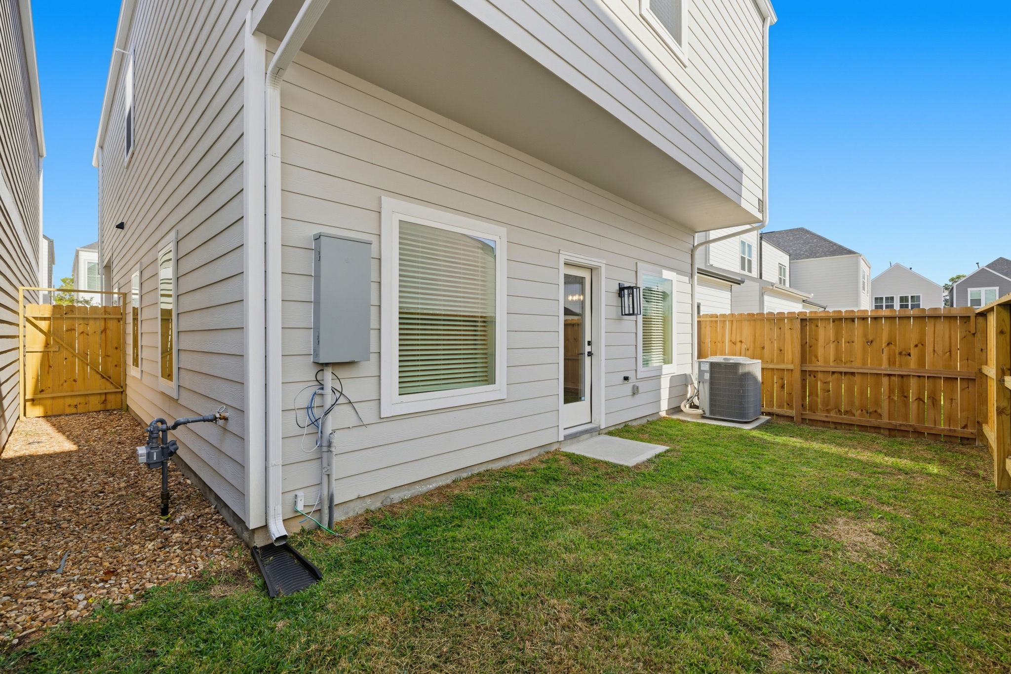 412 Stonework Landing Lane Houston, TX 77076 - Photo 29 of 30 a view of a house with backyard and porch