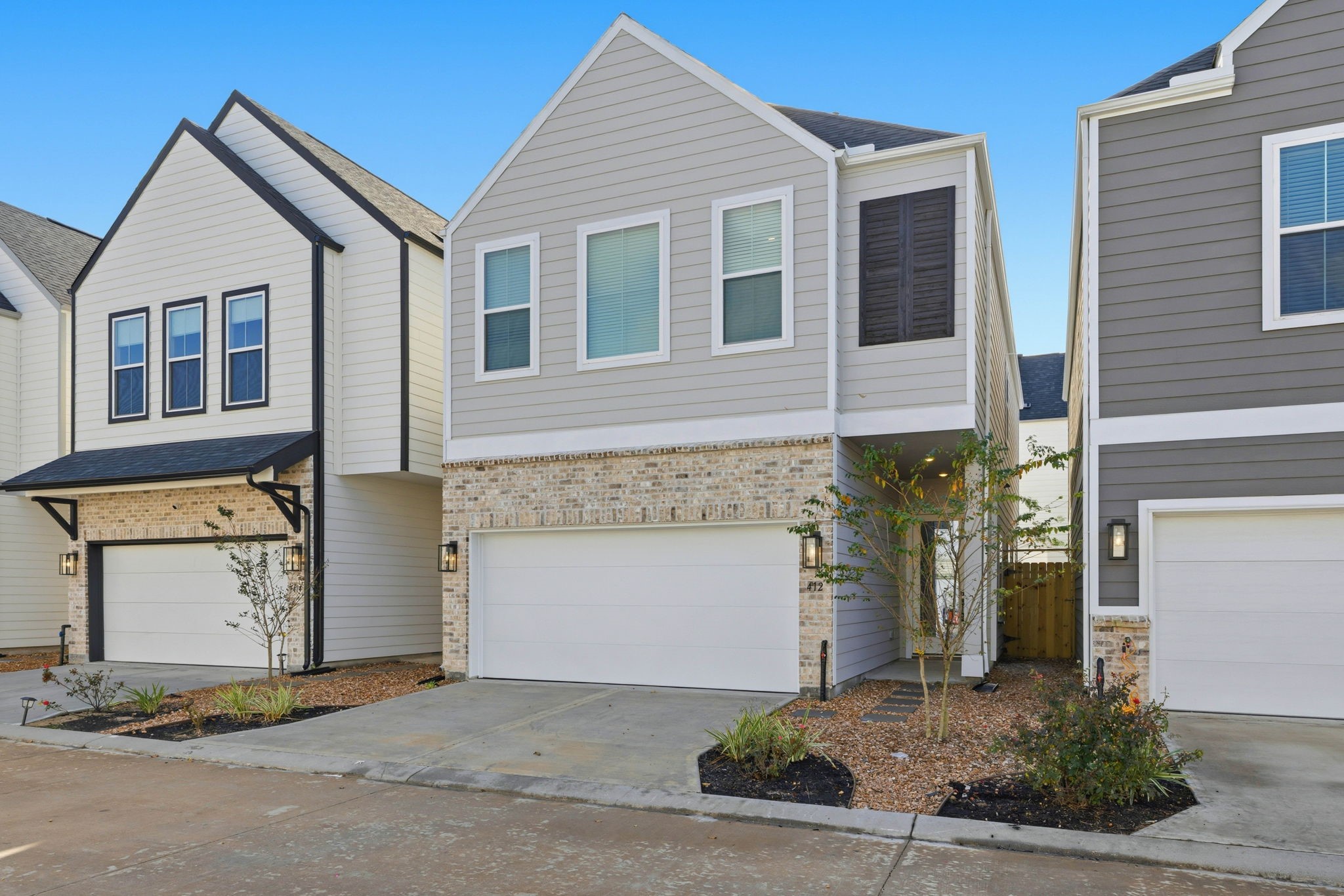 412 Stonework Landing Lane Houston, TX 77076 - Photo 3 of 30 a front view of a house with garage