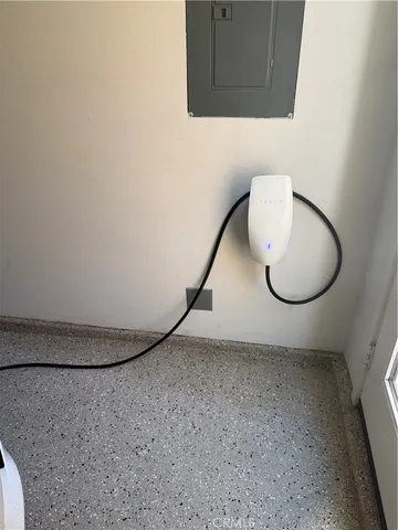 a view of a room with wooden floor and cabinets
