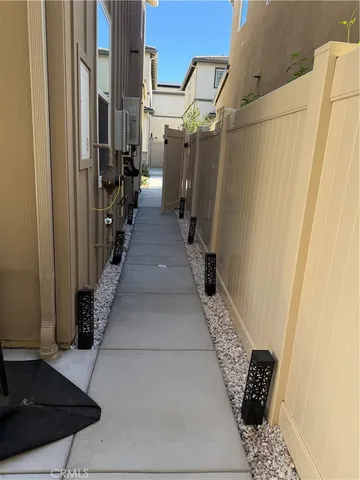 a view of a pathway of a house with wooden floor