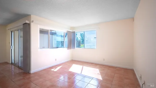 an empty room with windows