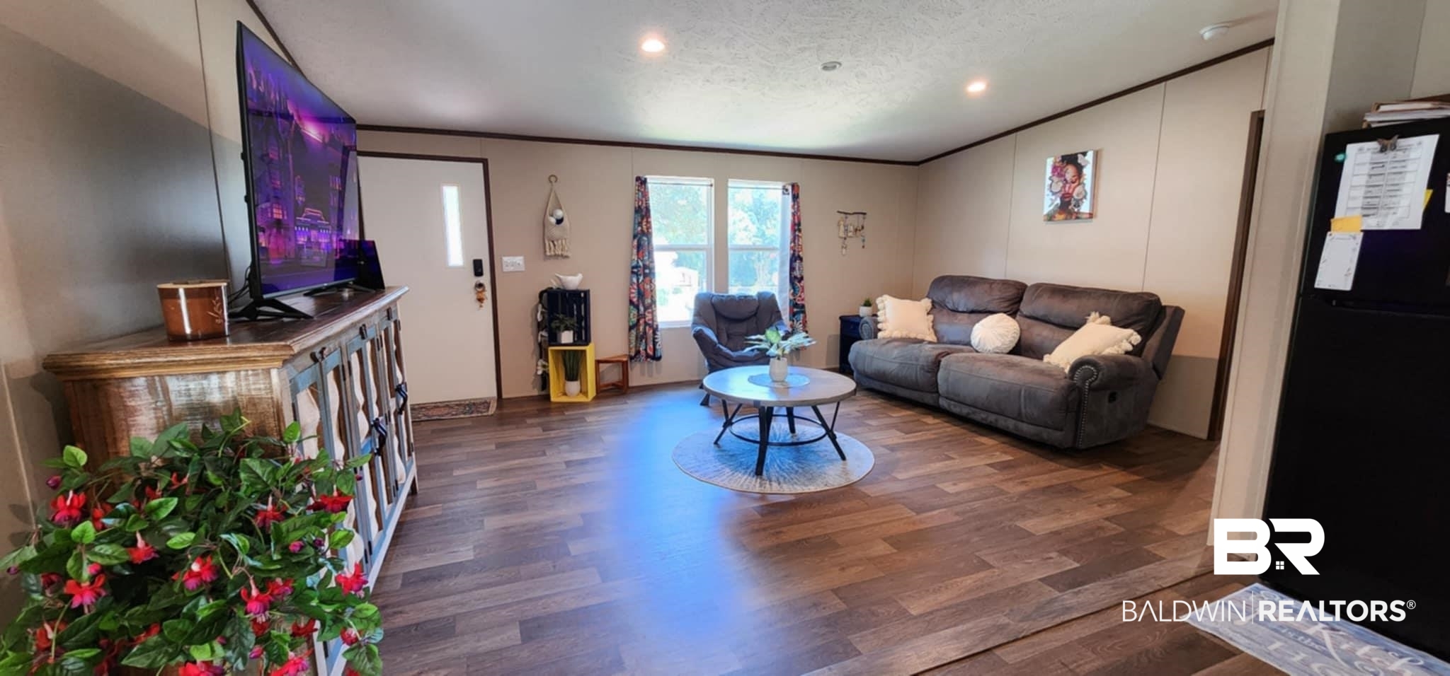 25474 Waterworld Road Robertsdale, AL 36567 - Photo 7 of 30 Living room with dark wood-type flooring, crown molding, a textured ceiling, and recessed lighting