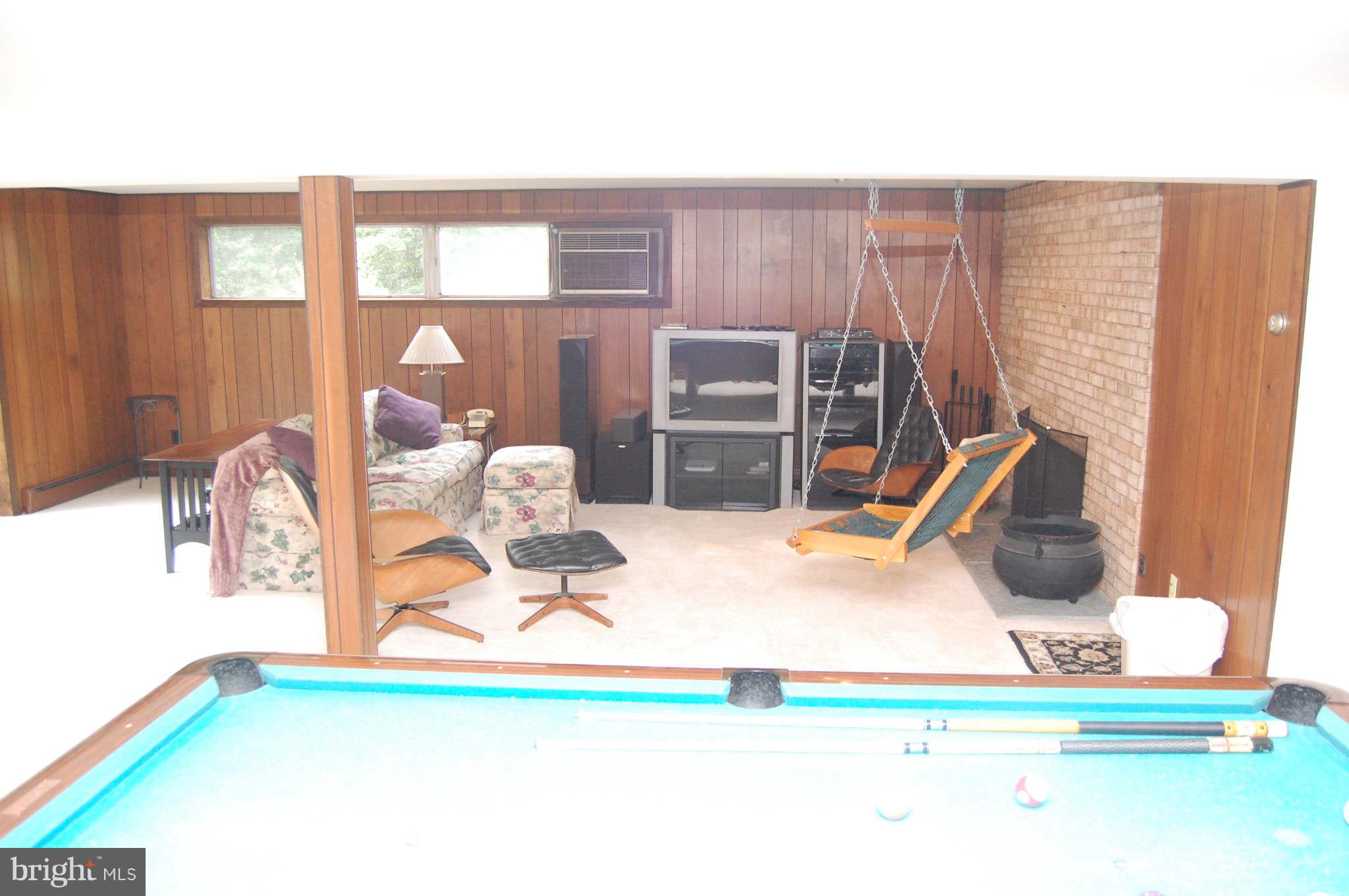 5525 Green Bridge Road Dayton, MD 21036 - Photo 25 of 30 TV area with brick walled wood burning fireplace