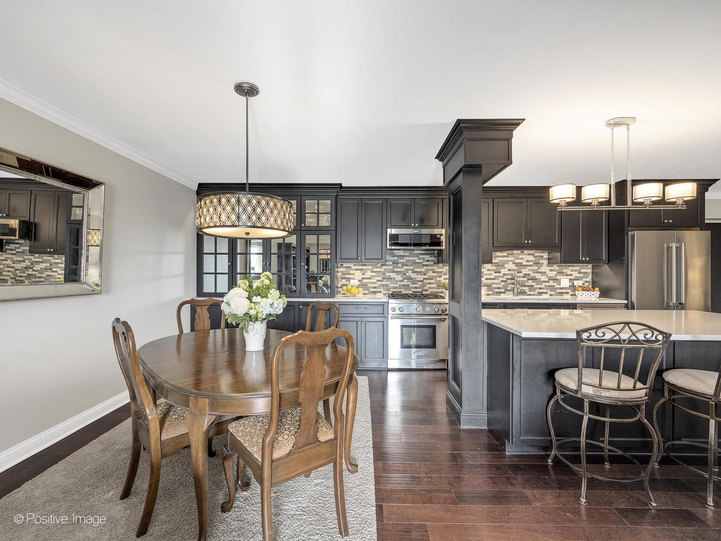 100 West Butterfield Road, Unit 401N Elmhurst, IL 60126 - Photo 12 of 29 a kitchen with a dining table chairs and wooden floor