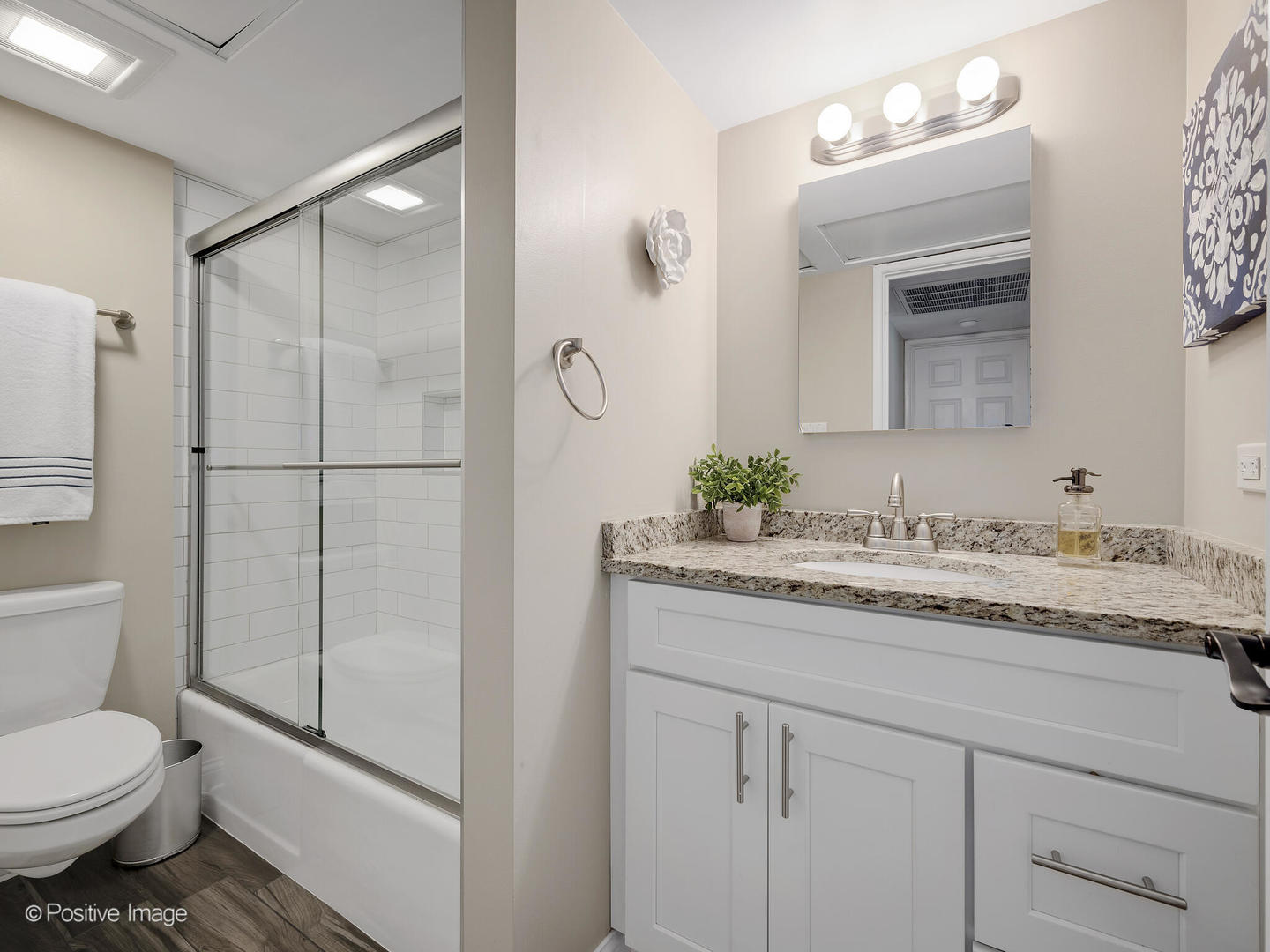 100 West Butterfield Road, Unit 401N Elmhurst, IL 60126 - Photo 21 of 29 a bathroom with a granite countertop sink toilet and shower