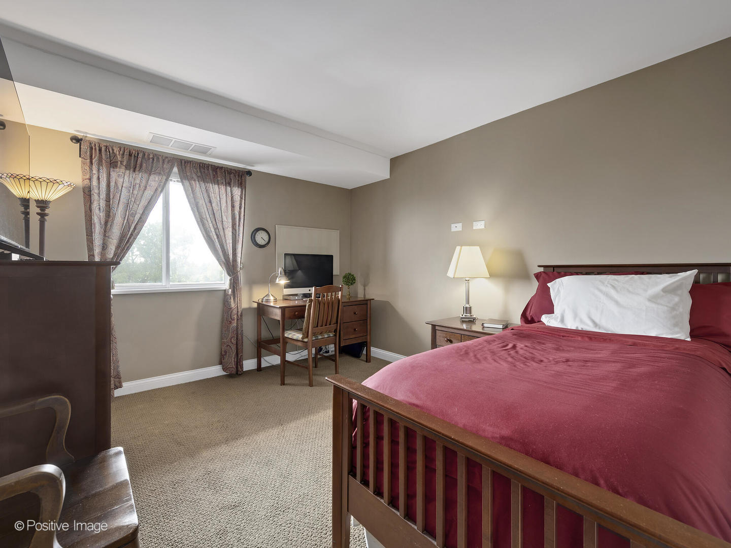 100 West Butterfield Road, Unit 401N Elmhurst, IL 60126 - Photo 22 of 29 a bedroom with a bed and a window