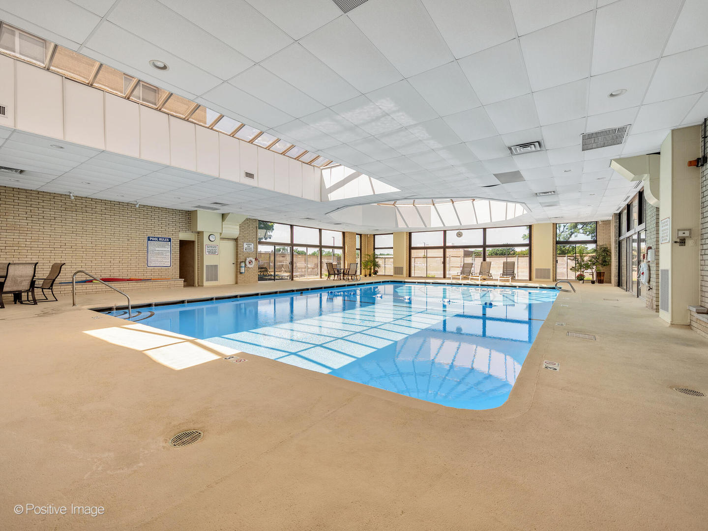 100 West Butterfield Road, Unit 401N Elmhurst, IL 60126 - Photo 24 of 29 an indoor swimming pool with outdoor seating