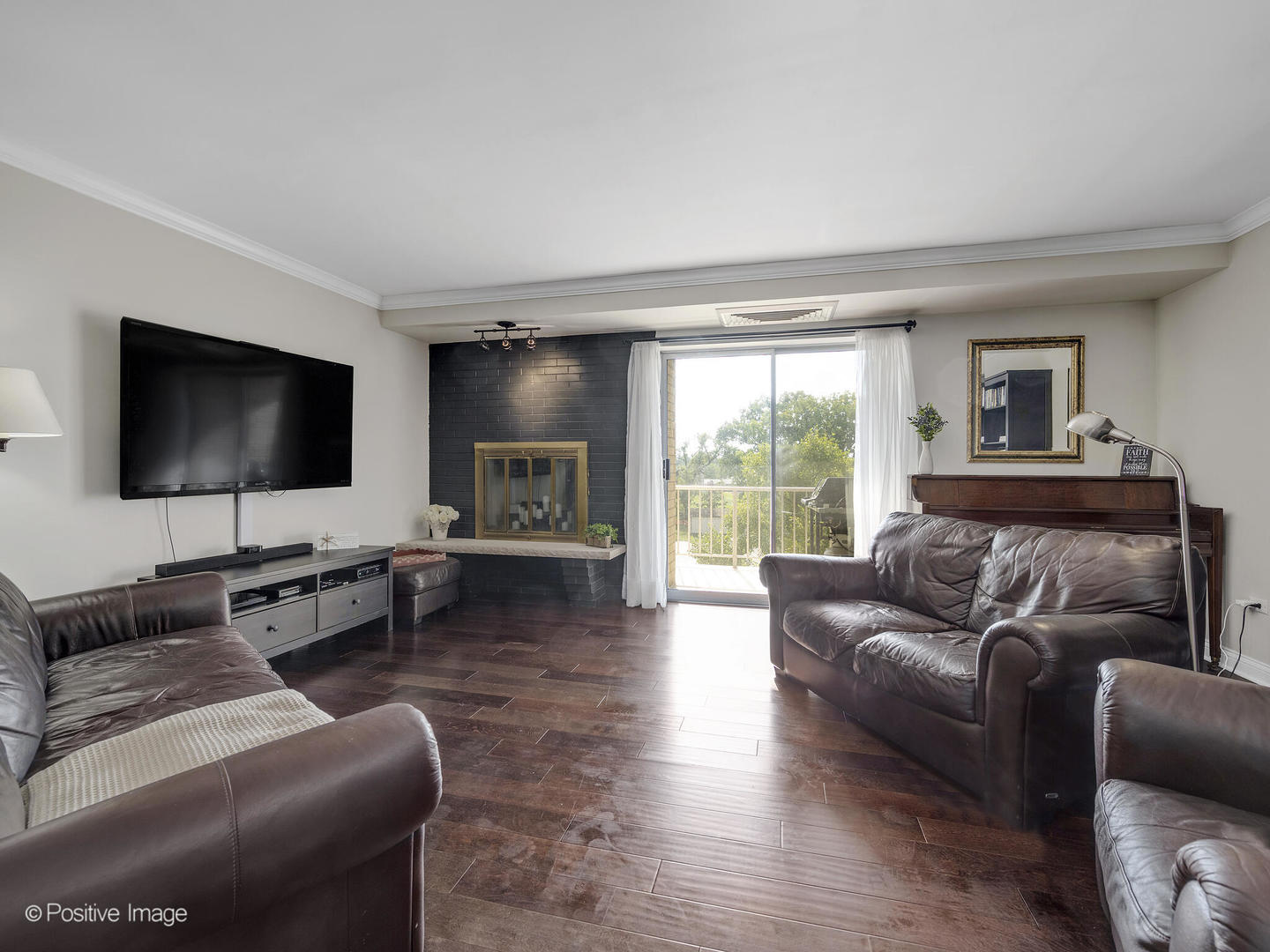 100 West Butterfield Road, Unit 401N Elmhurst, IL 60126 - Photo 5 of 29 a living room with furniture and a flat screen tv