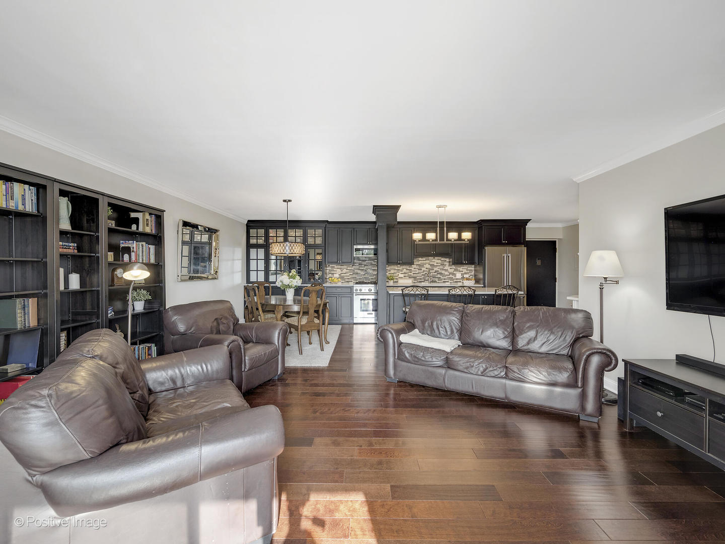 100 West Butterfield Road, Unit 401N Elmhurst, IL 60126 - Photo 6 of 29 a living room with furniture and a flat screen tv