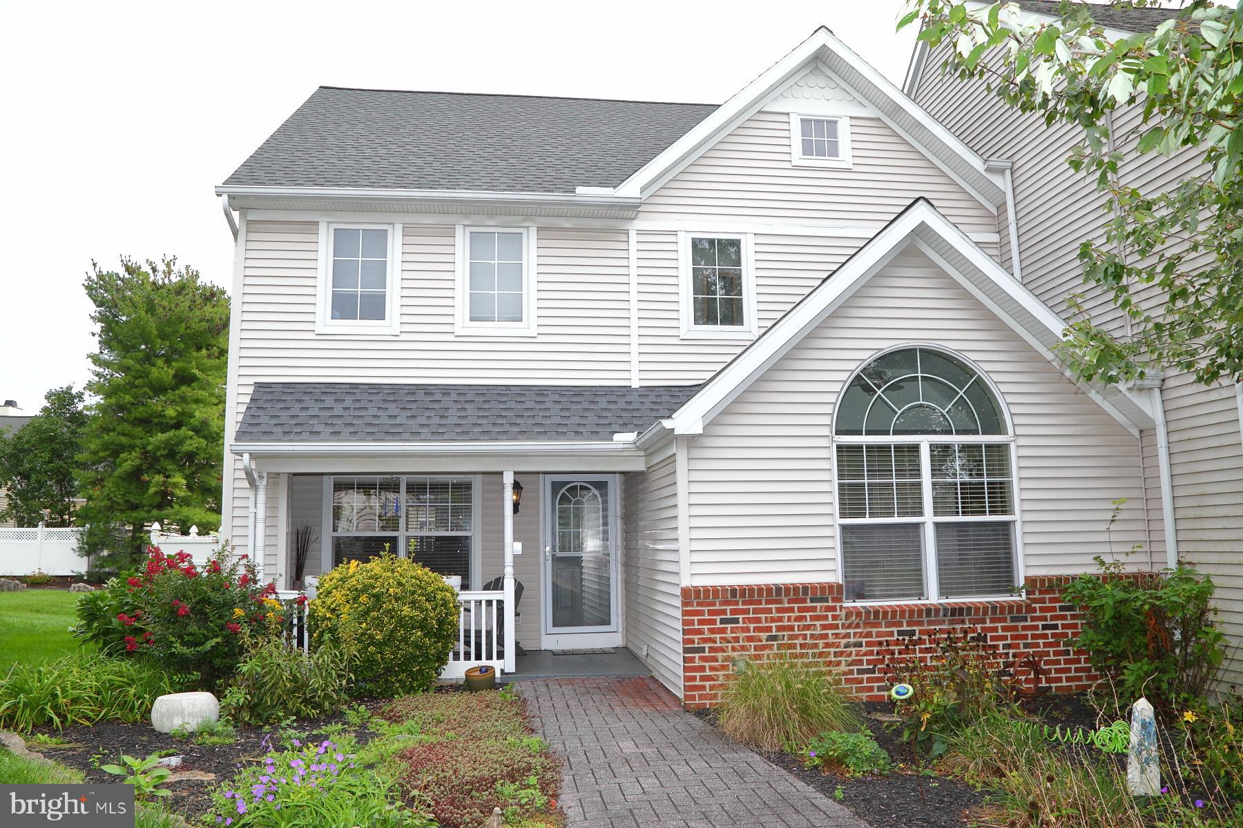 1049 Kent Garden Lititz, PA 17543 - Photo 1 of 29 a front view of a house with a yard and potted plants