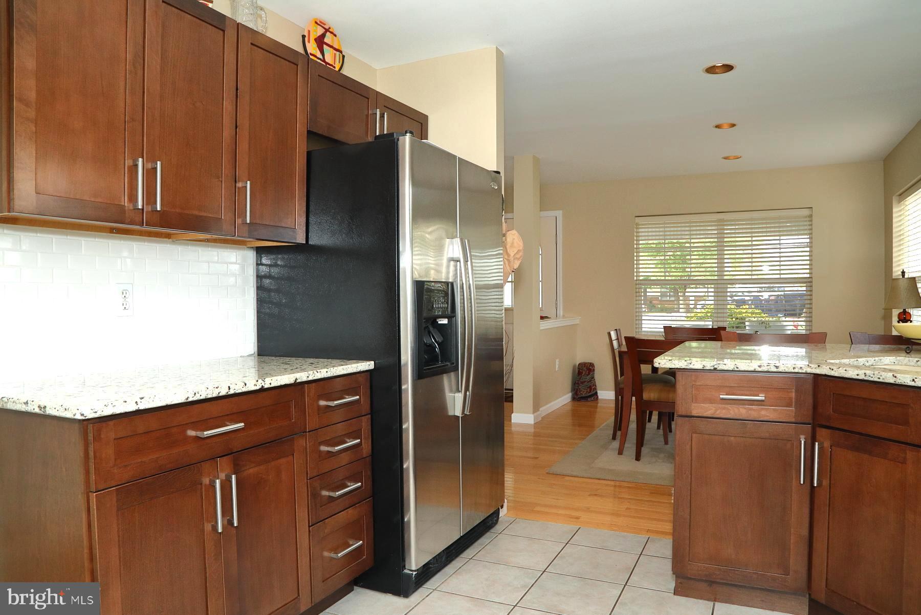 1049 Kent Garden Lititz, PA 17543 - Photo 16 of 29 a kitchen with stainless steel appliances granite countertop a refrigerator and a stove top oven