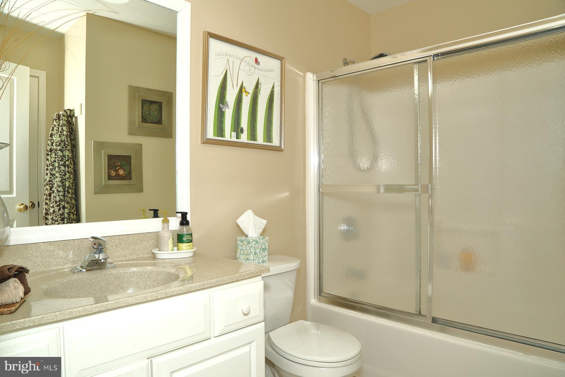 1049 Kent Garden Lititz, PA 17543 - Photo 9 of 29 a bathroom with a granite countertop sink a toilet and shower