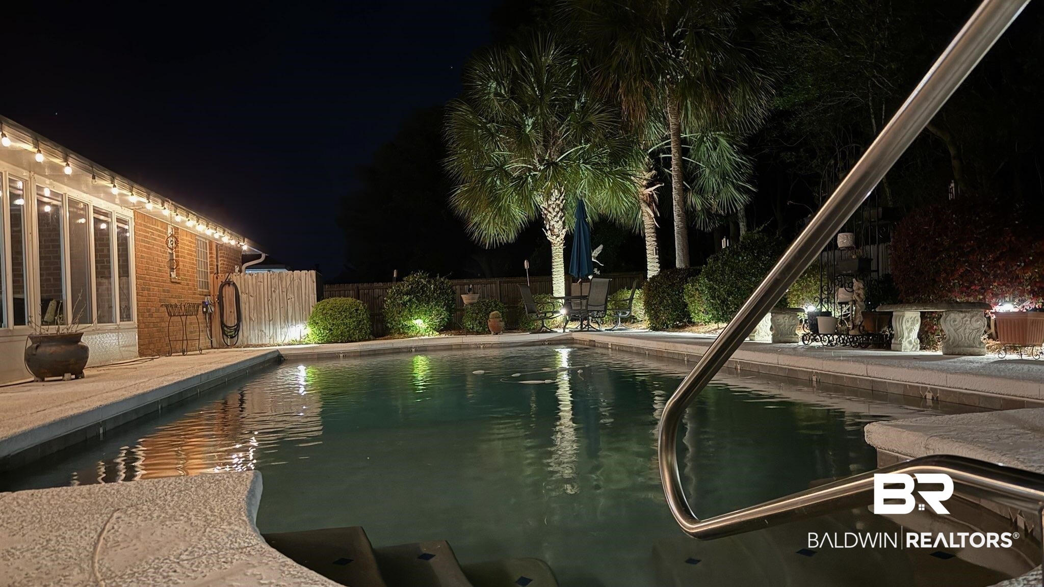 373 Collinwood Loop Foley, AL 36535 - Photo 43 of 49 Pool at night with a patio