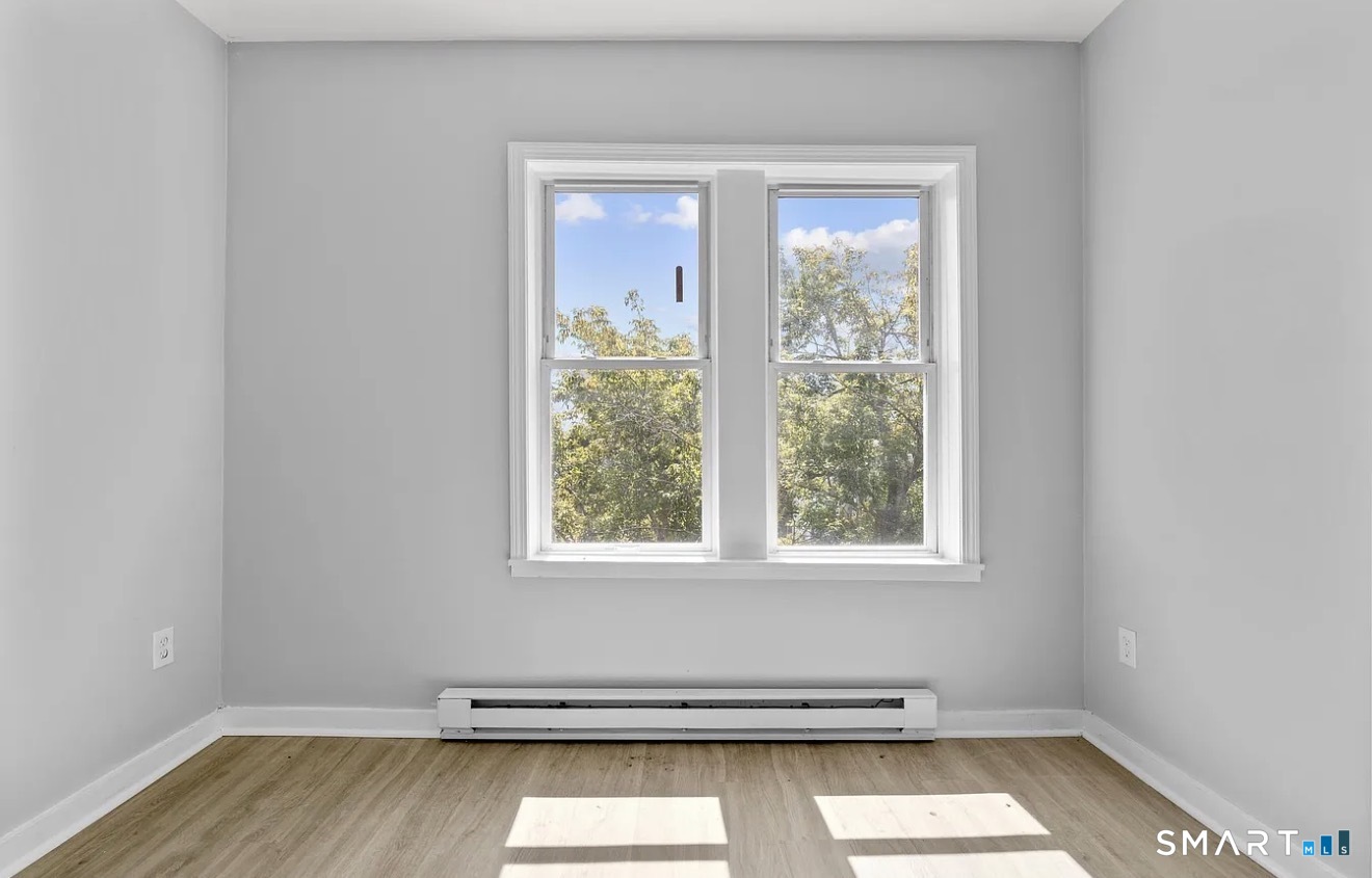 25 Whittier Street Bridgeport, CT 06605 - Photo 5 of 12 an empty room with a window