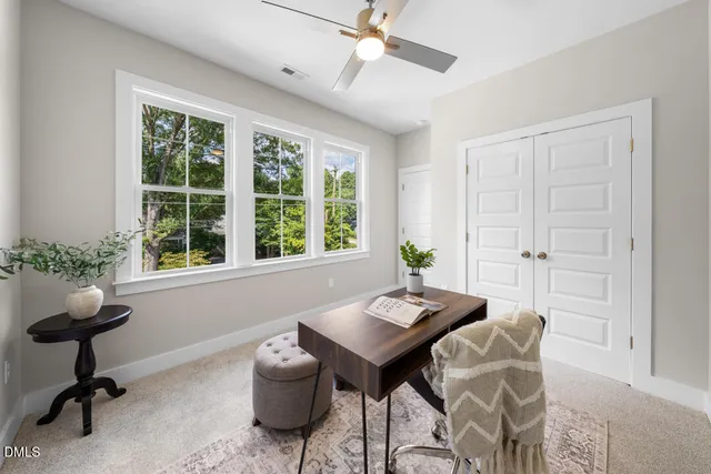 a view of a livingroom with furniture and a window
