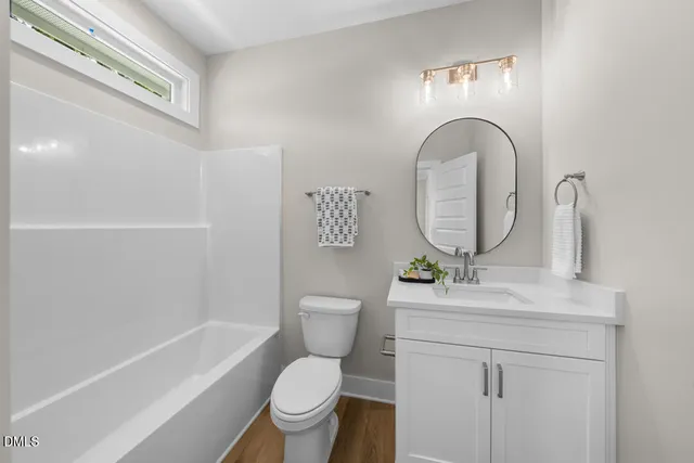 a bathroom with a sink toilet and a bathtub