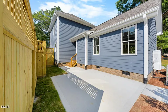 a backyard of a house with seating space
