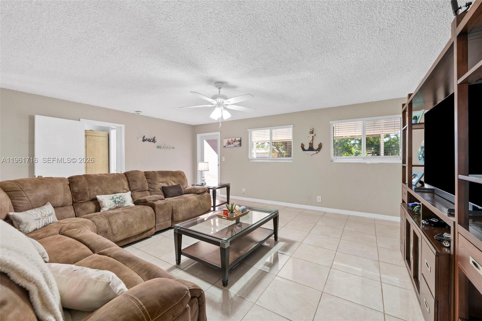 1916 North 36th Avenue Hollywood, FL 33021 - Photo 11 of 22 a living room with furniture and a flat screen tv