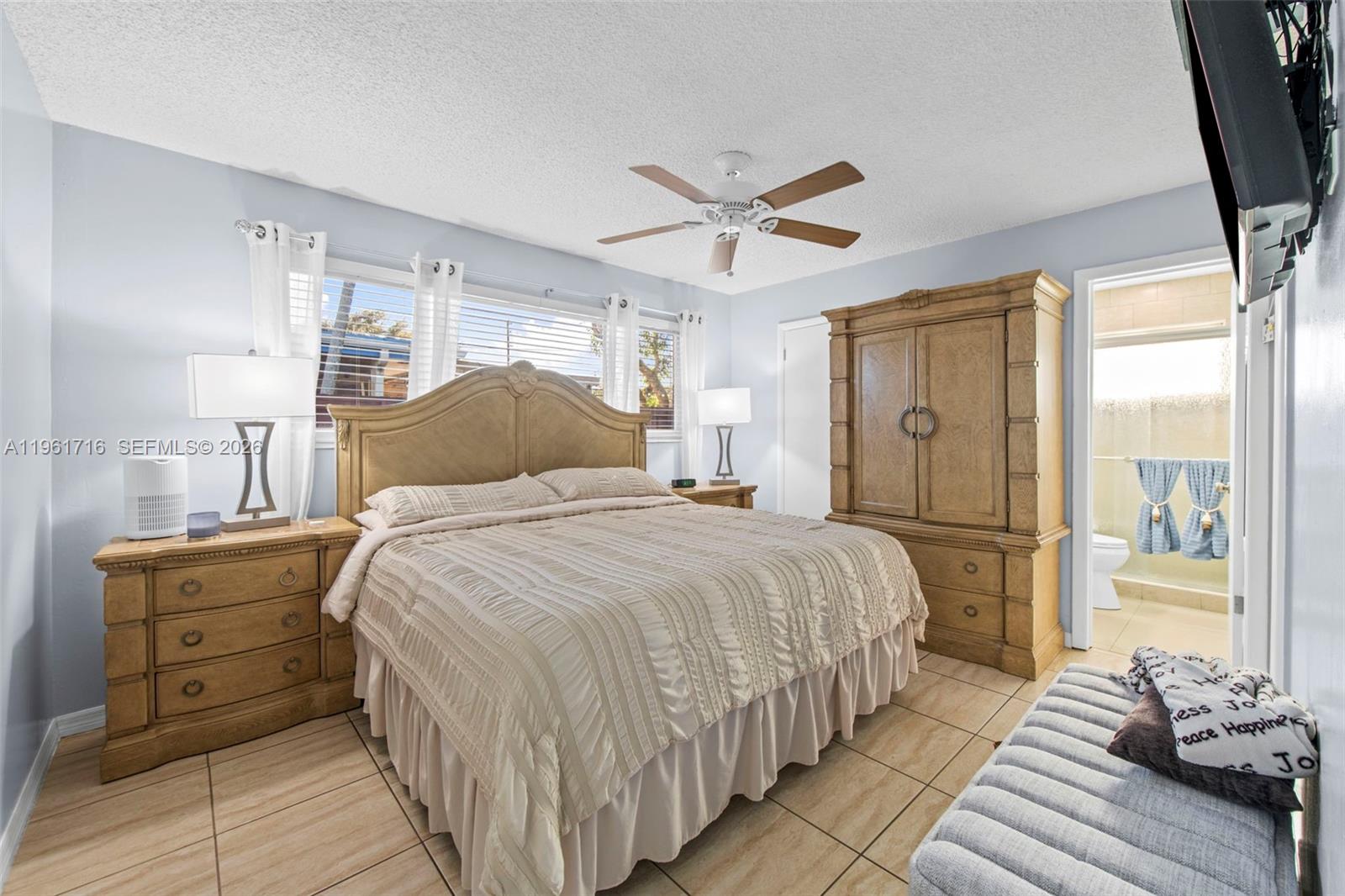 1916 North 36th Avenue Hollywood, FL 33021 - Photo 12 of 22 a bedroom with a bed and wooden floor