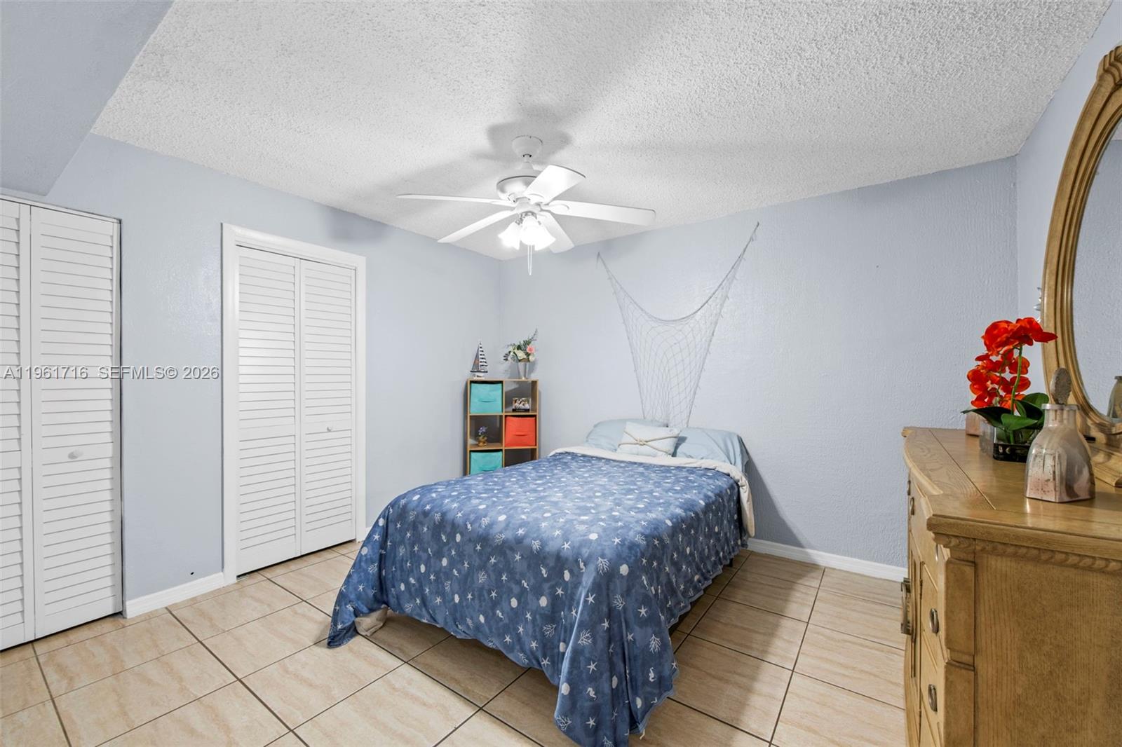 1916 North 36th Avenue Hollywood, FL 33021 - Photo 16 of 22 a bedroom with a bed and a chandelier