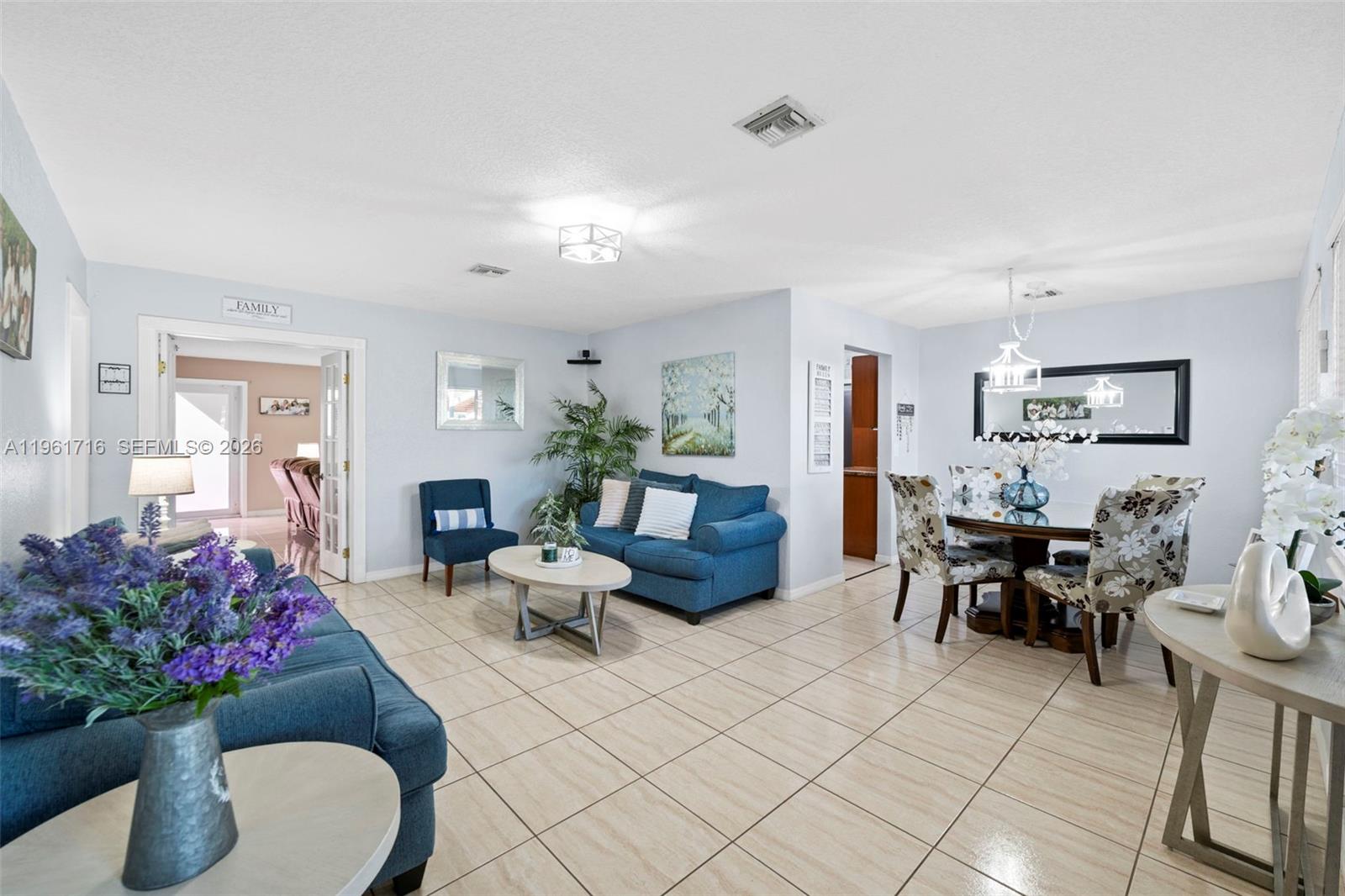 1916 North 36th Avenue Hollywood, FL 33021 - Photo 4 of 22 a living room with furniture and flowers