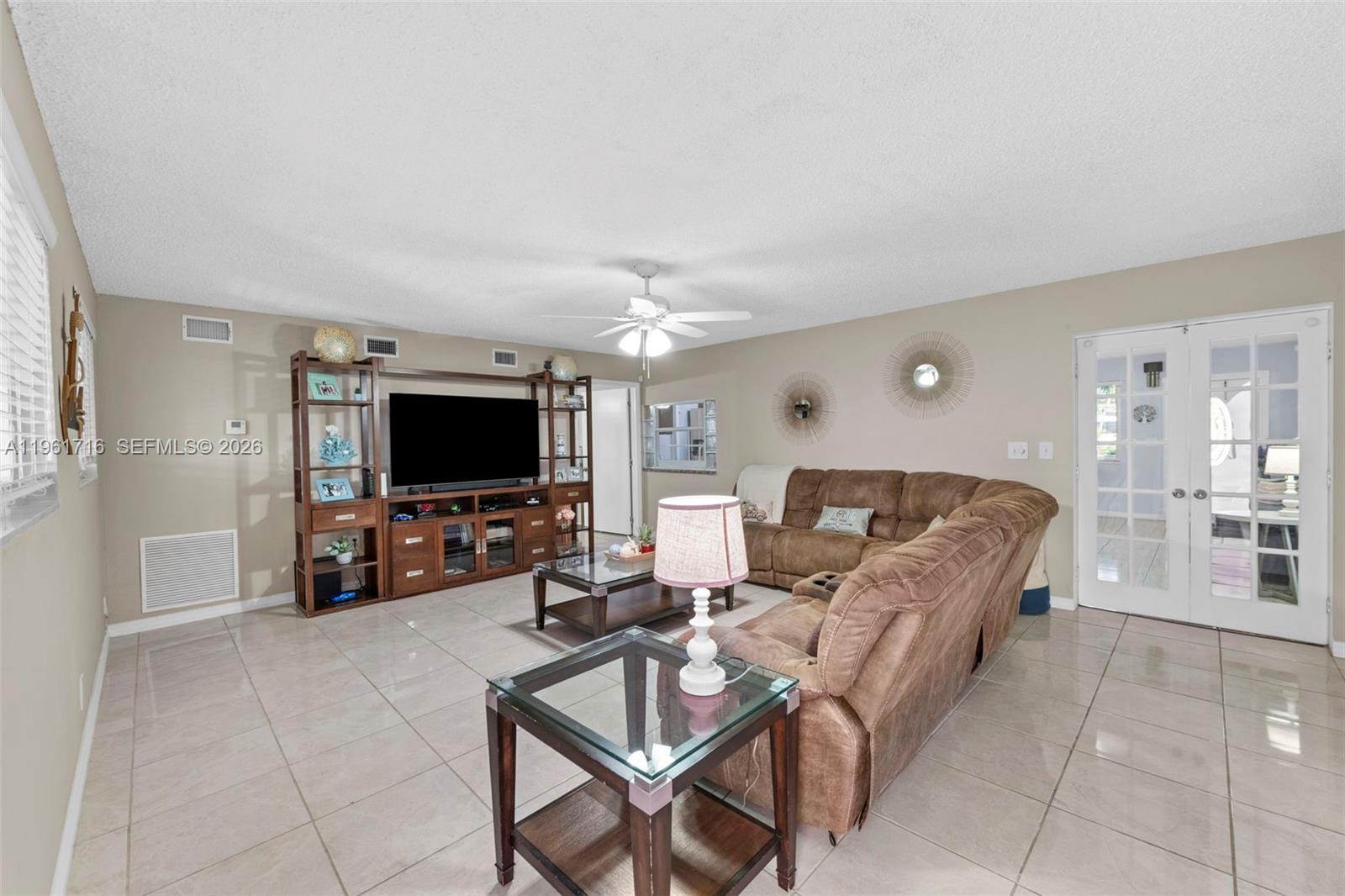 1916 North 36th Avenue Hollywood, FL 33021 - Photo 10 of 22 a living room with furniture and a flat screen tv