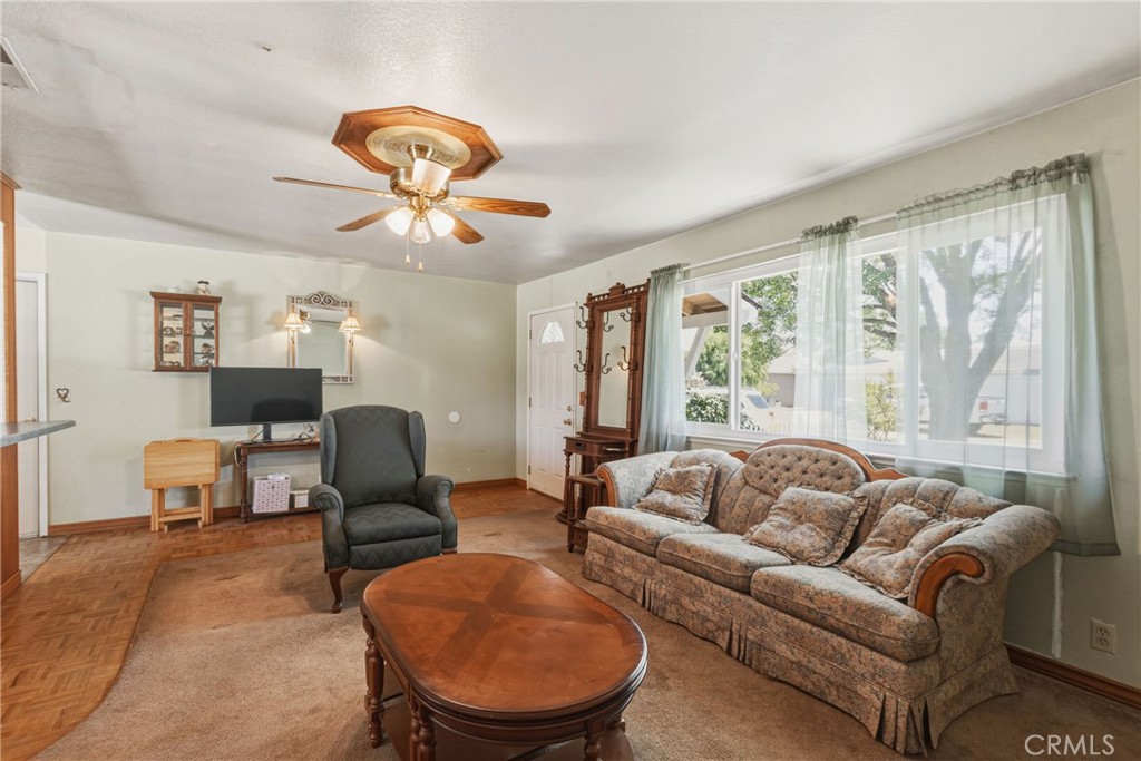 6812 Helton Street Winton, CA 95388 - Photo 5 of 24 a living room with furniture and a large window