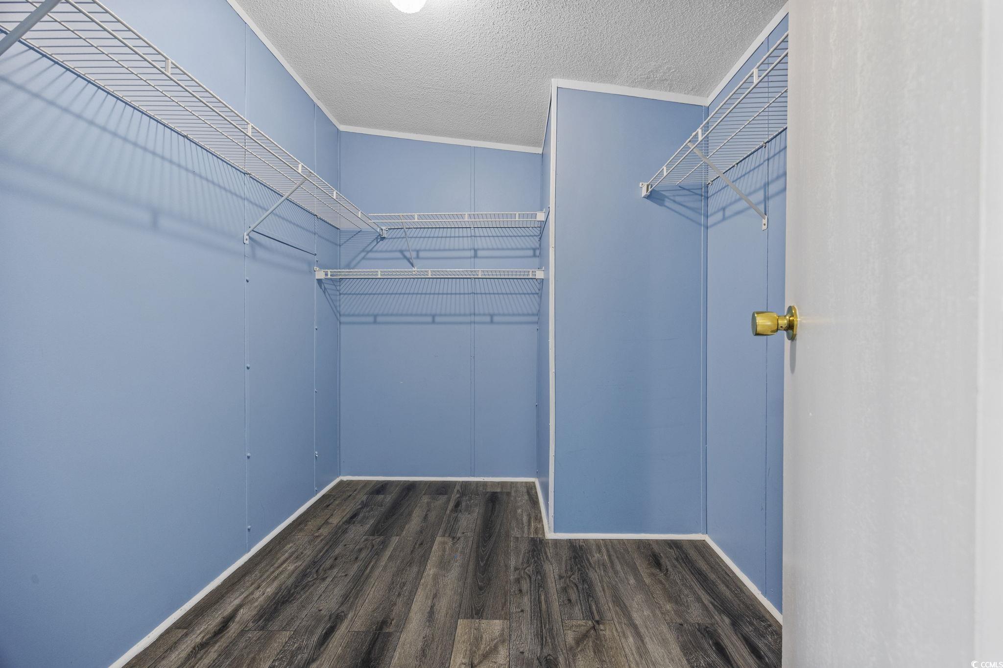 2000 Highway 15 Myrtle Beach, SC 29577 - Photo 14 of 27 Spacious closet with dark wood-style floors
