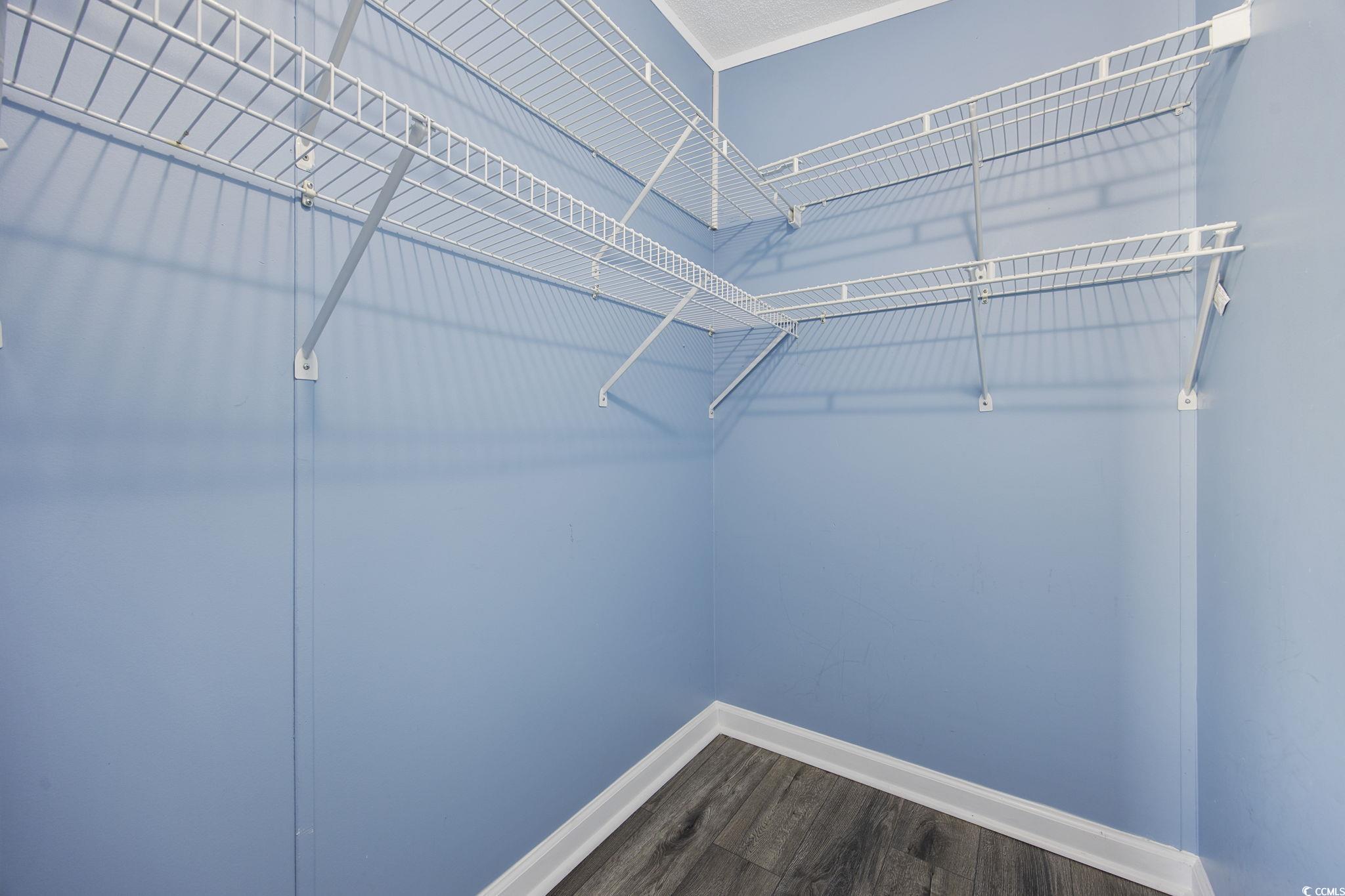 2000 Highway 15 Myrtle Beach, SC 29577 - Photo 20 of 27 Spacious closet with dark wood-style flooring