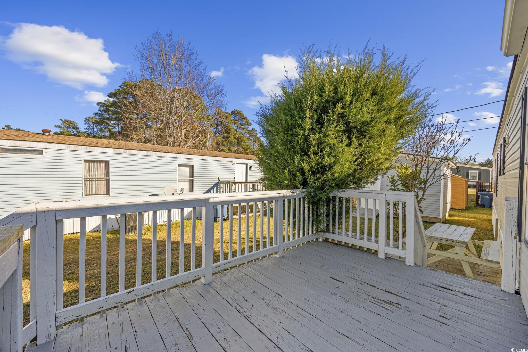 2000 Highway 15 Myrtle Beach, SC 29577 - Photo 21 of 27 Wooden terrace with a storage shed and a lawn