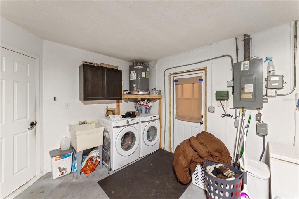 8715 Huntsman Lane Port Richey, FL 34668 - Photo 51 of 54 a view of a kitchen with fridge and workspace