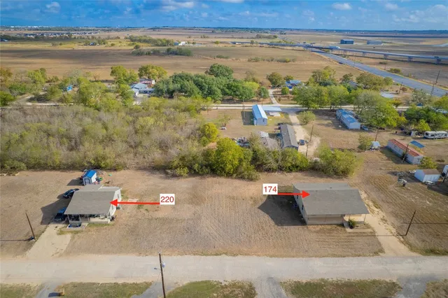an aerial view of a yard with ocean view