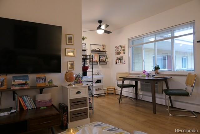 830 20th Street, Unit 303 Boulder, CO 80302 - Photo 4 of 28 a living room with furniture and a flat screen tv