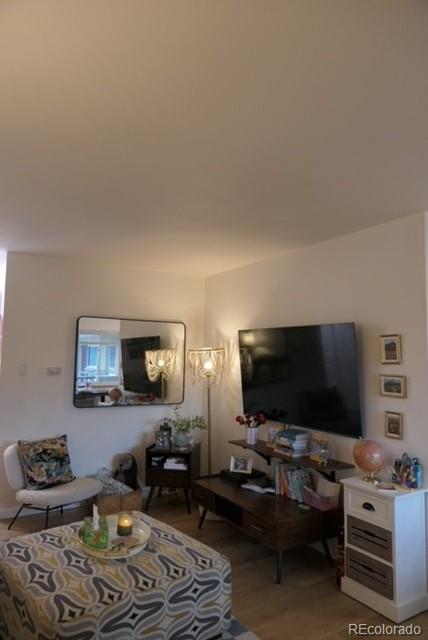830 20th Street, Unit 303 Boulder, CO 80302 - Photo 6 of 28 a living room with furniture and a flat screen tv