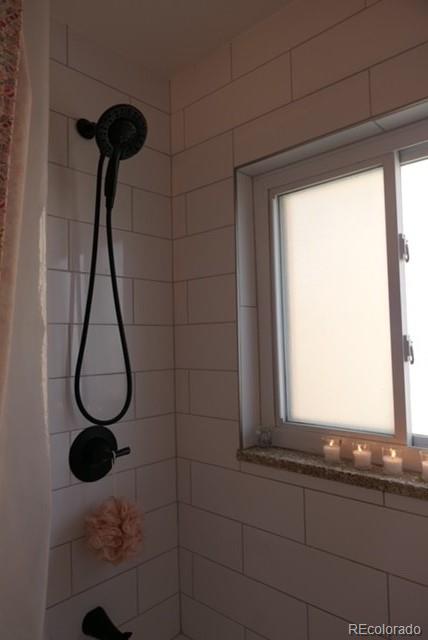 830 20th Street, Unit 303 Boulder, CO 80302 - Photo 9 of 28 a bathroom with a shower and a window